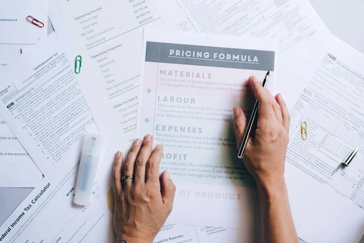A professional business meeting analysing pricing strategy